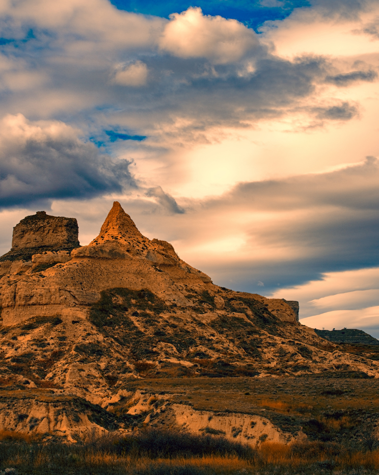 a mountain and a cloudy sky